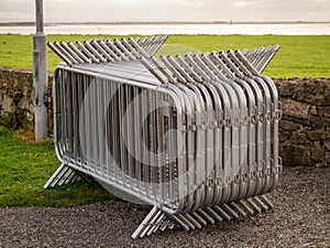 Stack of metal crowed control barriers ready to assemble in town, Concept event, music festival preparation