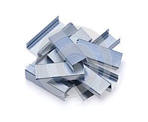 Stack of metal staples isolated on a white background