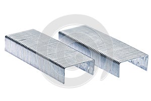 Stack of metal staples. Isolated on a white.