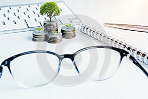 Stack of money coins with account book finance for background. b