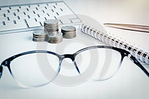 Stack of money coins with account book finance for background. b