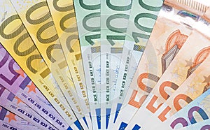 Stack of money with 50 100 200 and 500 euro banknotes