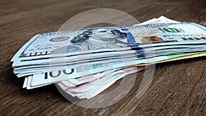 A stack of money is lying on the table. Close-up