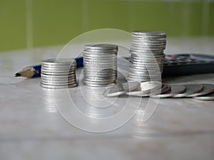 Stack of money, rows of coins for finance