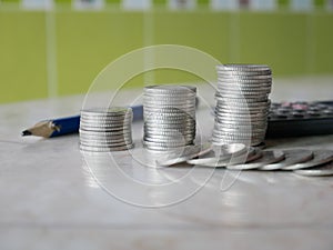 Stack of money, rows of coins for finance