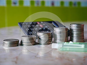 Stack of money, rows of coins for finance