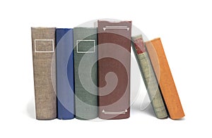 Stack of multi colored books isolated on white