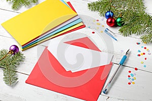 Stack of multi-colored envelopes with congratulations on Christmas