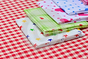Stack of Multicolor napkin with checkered fabric