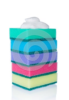 Stack of multicolor sponges and foam  on white background