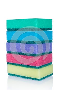 Stack of multicolor sponges isolated on white background