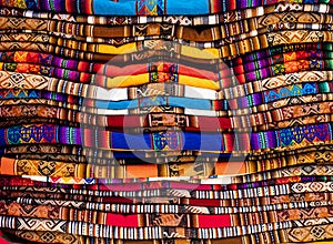 Stack of multicolored andean textile and fabrics in Pisac