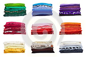 Stack of multicolored clothes isolated on white background