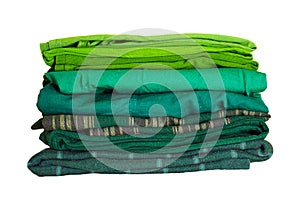 Stack of multicolored clothes isolated on white background