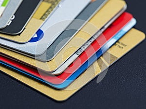 Stack of multicolored credit cards close-up
