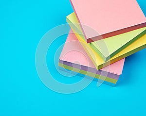 stack of multicolored empty paper square stickers