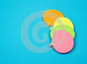 stack of multicolored empty paper stickers in the form of clouds