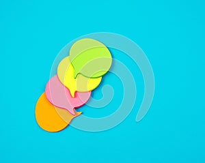 stack of multicolored empty paper stickers in the form of clouds