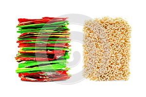 Stack of Multicolored Foil Plastic Bags and Block of Dried Instant Noodles, Ramen Isolated on White Background. Fast Food,