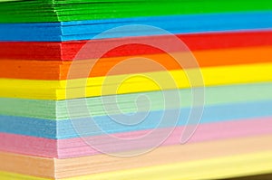 Stack of multicolored paper sheets