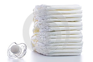 Stack of Nappies and Pacifier