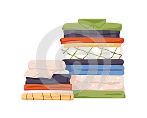 Stack of neat and clean clothes. Pile of neatly folded shirts, tshirts, jeans, trousers, pants and bath towels. Flat