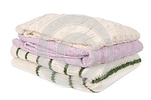 stack of neatly folded female clothes isolated on a white