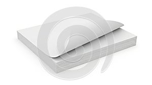 Stack of neatly folded white paper sheets on a flat surface