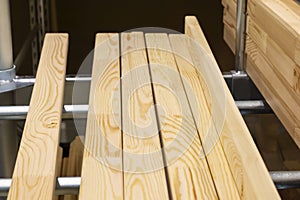 A stack of new wood panels in a hardware store.