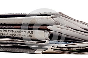 Stack of newpapers on a white background