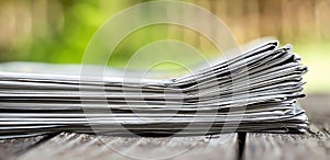 Stack of newspapers, daily news banner or background