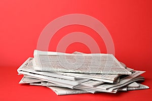 Stack of newspapers on background. Journalist`s work