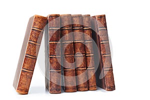 Stack of nine antique books, isolated white background