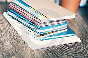 Stack of notebooks background, in office for education learning concept