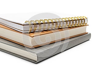 Stack of notebooks and books isolated on white background