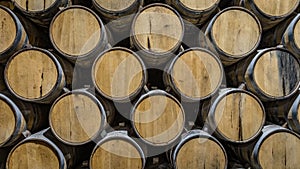 Stack of oak barrels aging tequila in Mexico