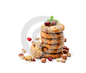 Stack of oat cookies with cranberry and pistachio isolated on w