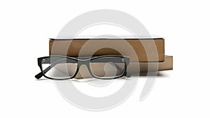 Stack og book and eyeglasses