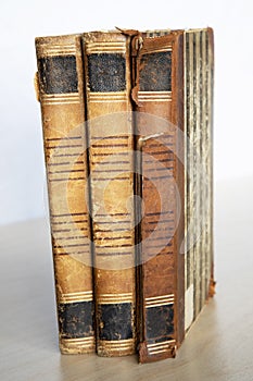Stack old books on wooden table
