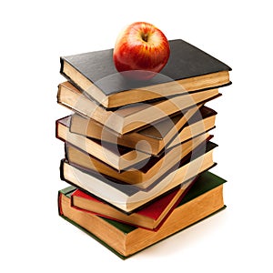 Stack of Old Books With an Apple on Top