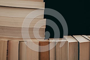 Stack of old books background. Many books on a pile. Books on vintage background.