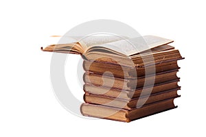 A stack of old books bound in brown leather, isolated on a white background. Space for text