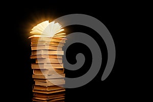 Stack of old books isolated on black background