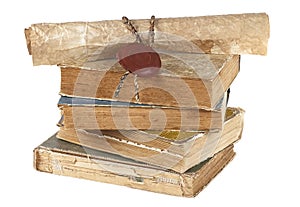 Stack of old books and kraft paper scroll on white background