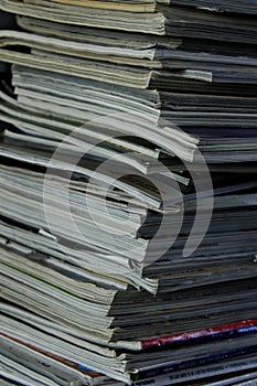 Stack of old books and magazines on a table- Close up