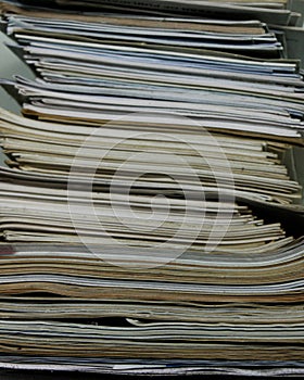 Stack of old books and magazines on a table- Close up