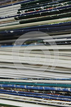 Stack of old books and magazines on a table- Close up