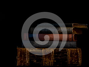 Stack of Old Books with Shadow and black background