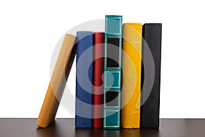 Stack of old books on shelf book on White background