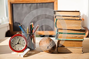 Stack of old books on wood desk